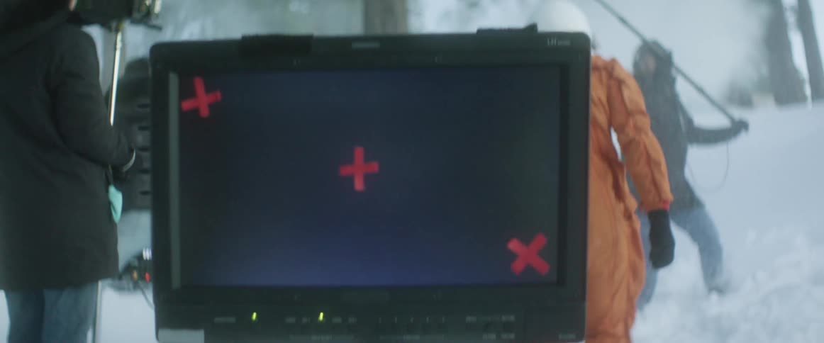 A group of people are filming outdoors in winter