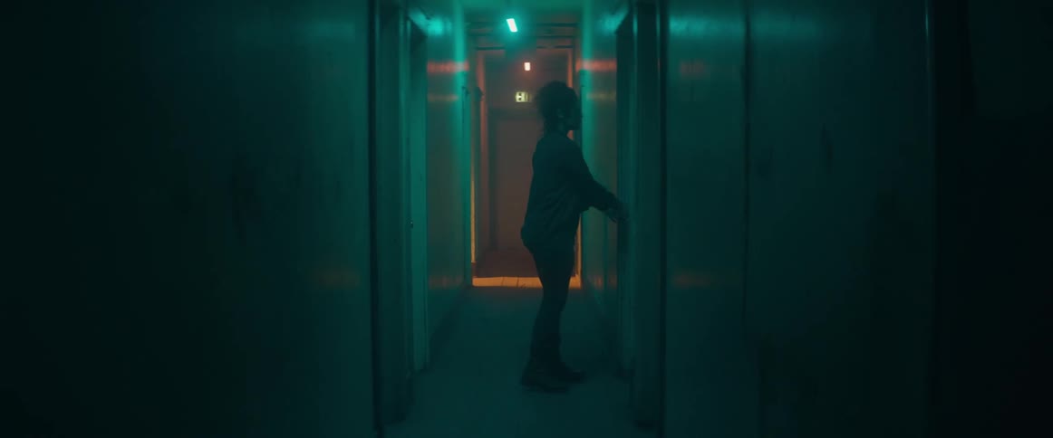 A man walking in a hallway