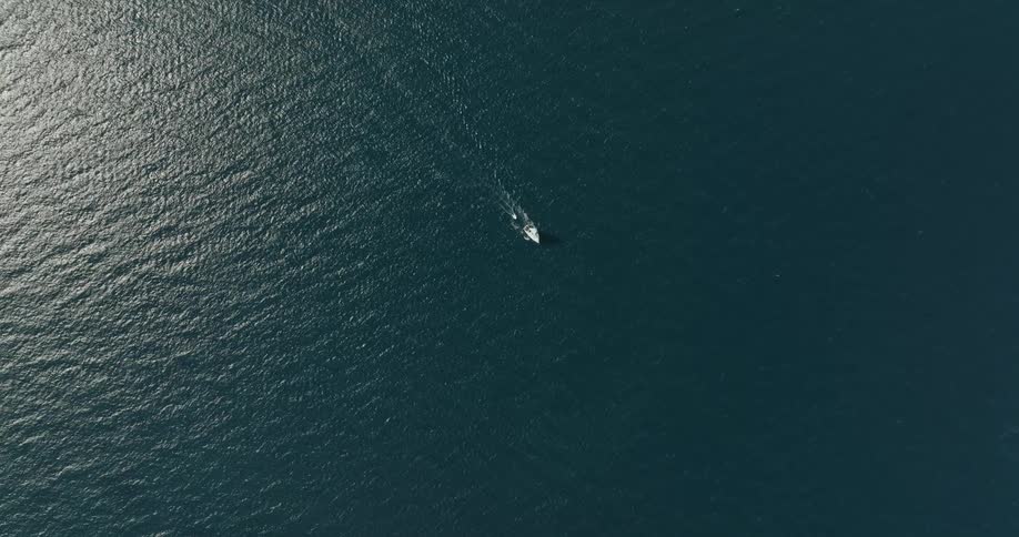 The boat is sailing in the ocean