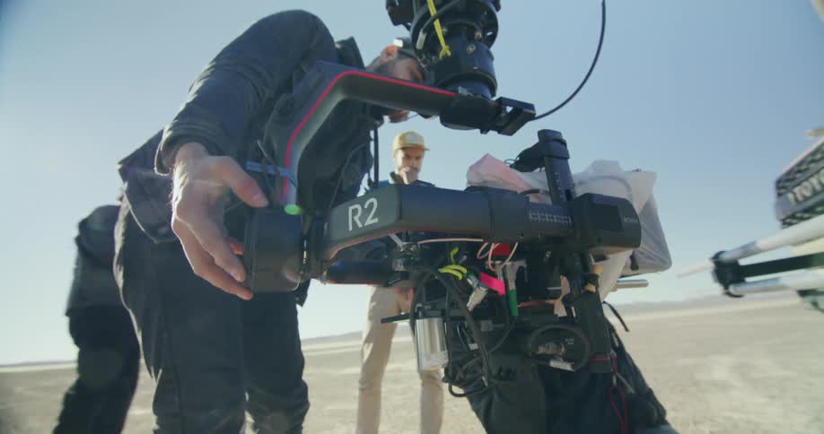 A camera is being setup in the desert