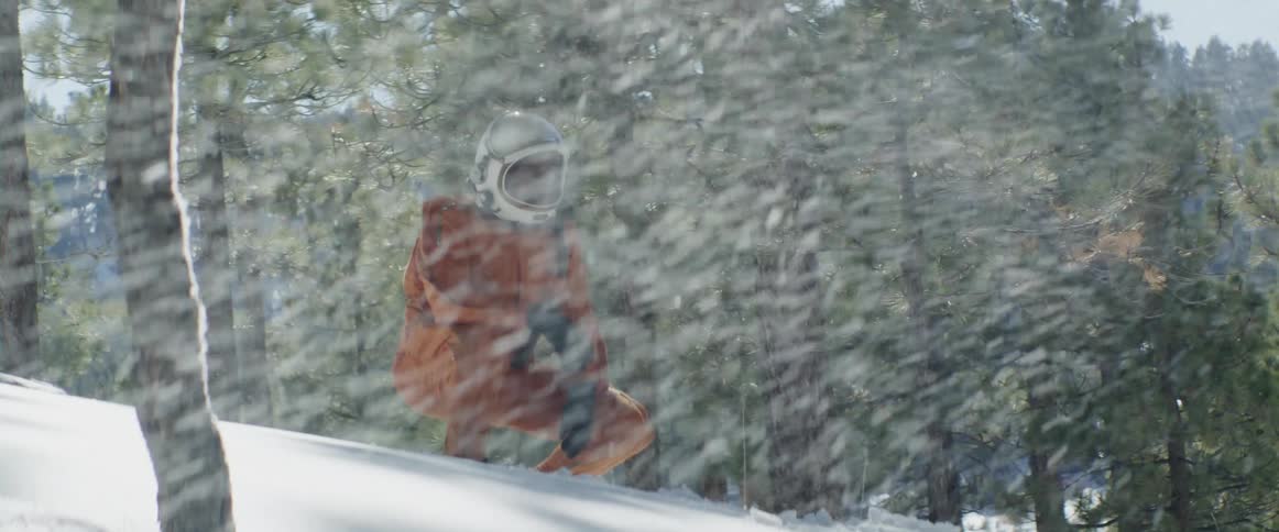 A man is wearing a helmet and outdoors in a snow storm