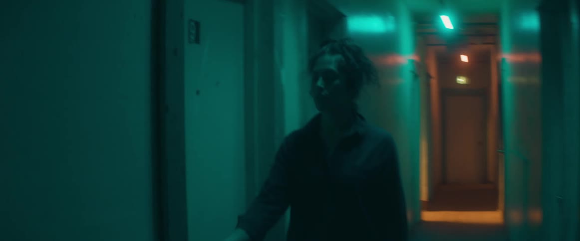 A woman walks down the hall