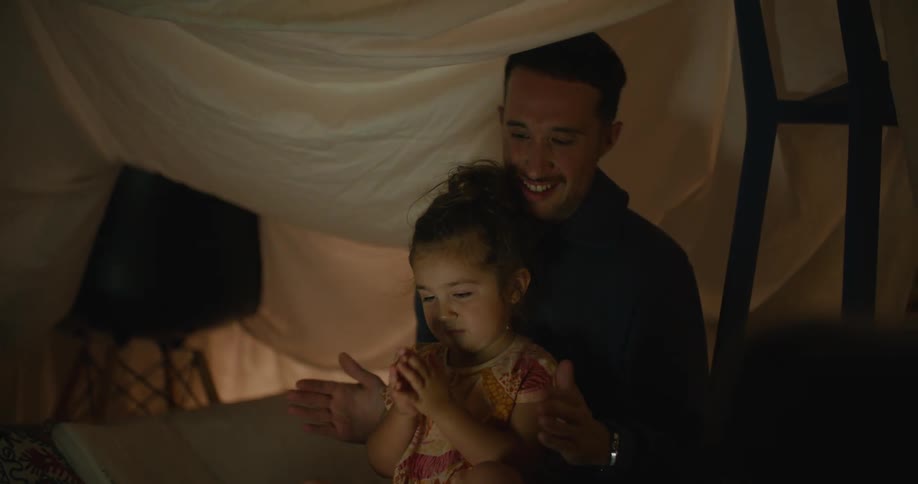 A father and daughter playing