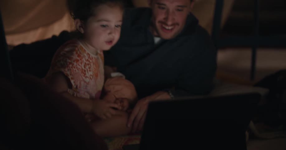 A father and daughter relaxing