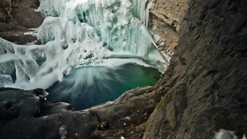 A frozen waterfall and a small lake