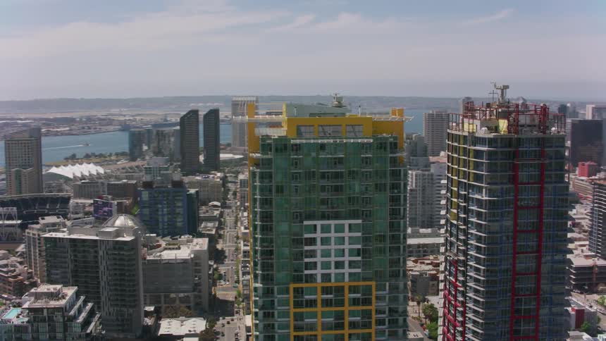 A pair of skyscrapers in a metropolis during the day