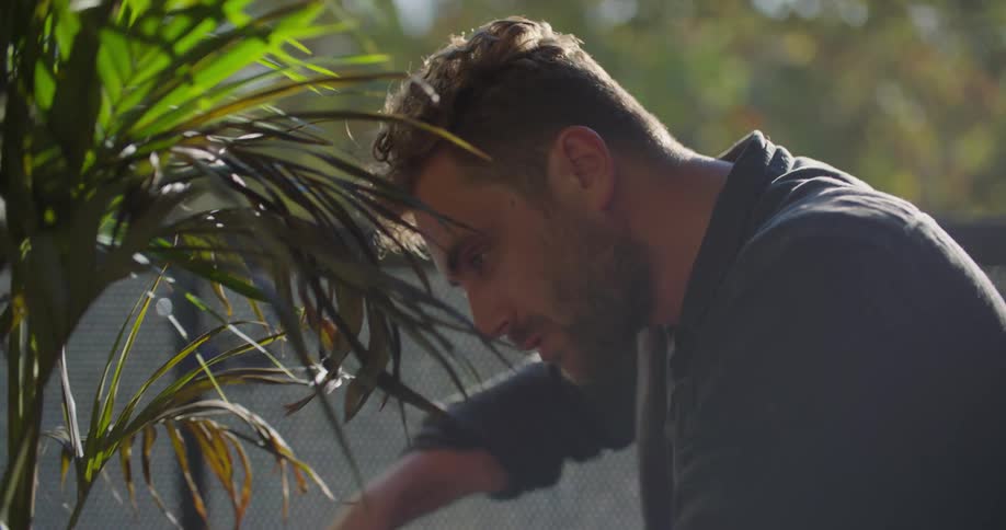 A man is gardening outside