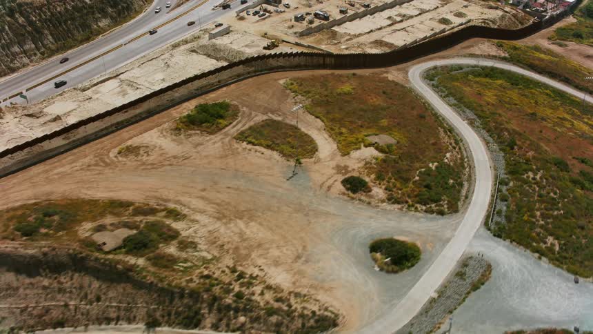 Aerial view of the border wall between Mexico and USA in Southern California