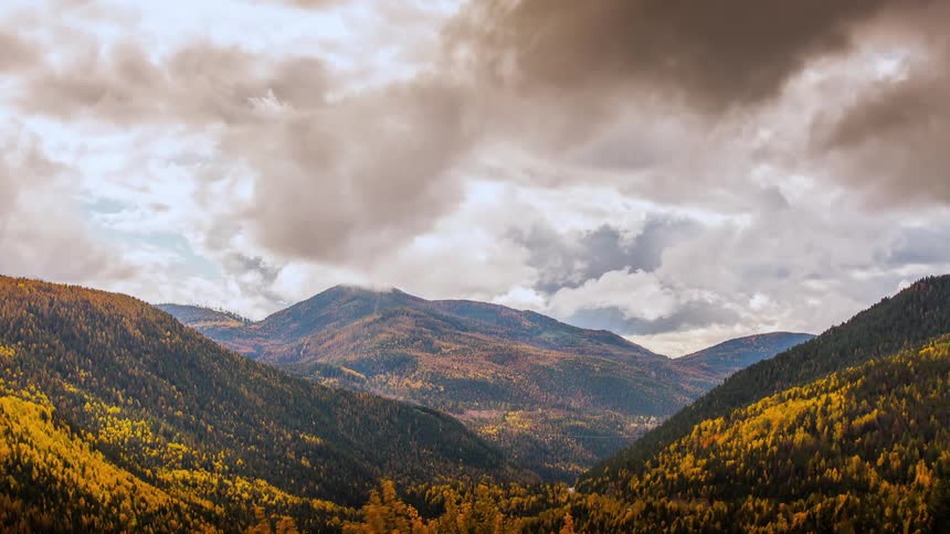 Clouds float over a mountain range