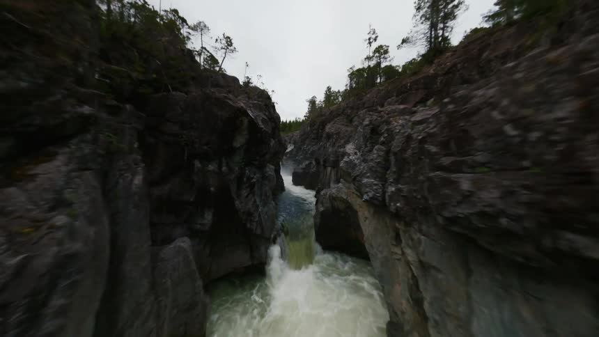 A river is flowing through a mountainous area