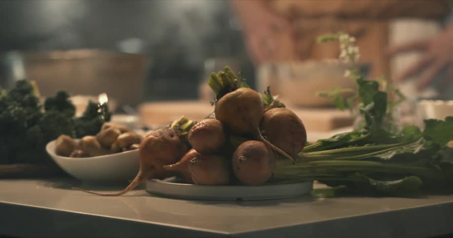 A person standing in a room with food