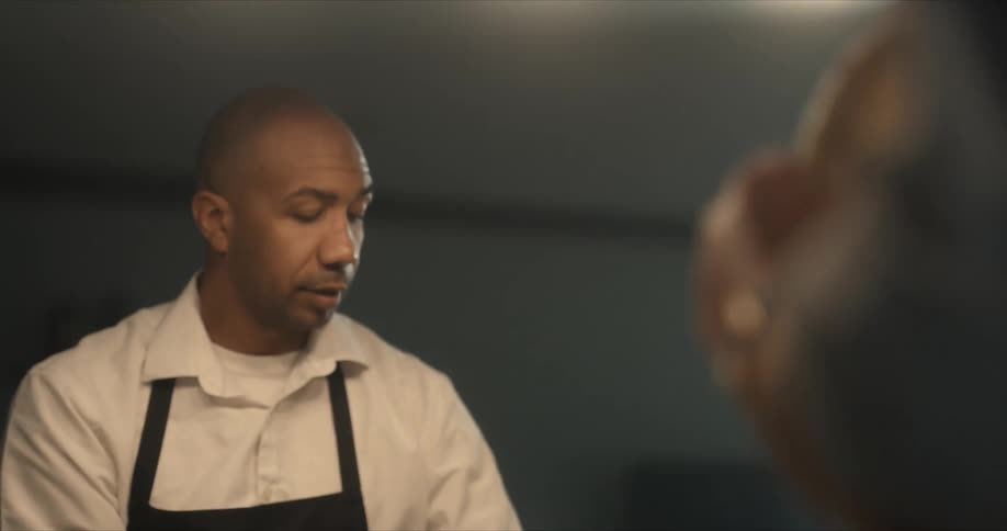 Two chefs working in a room