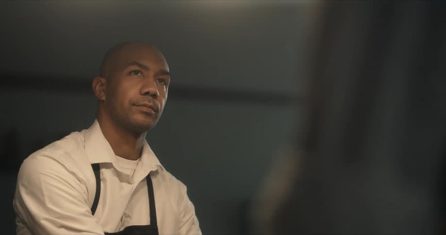 A chef is talking in the kitchen