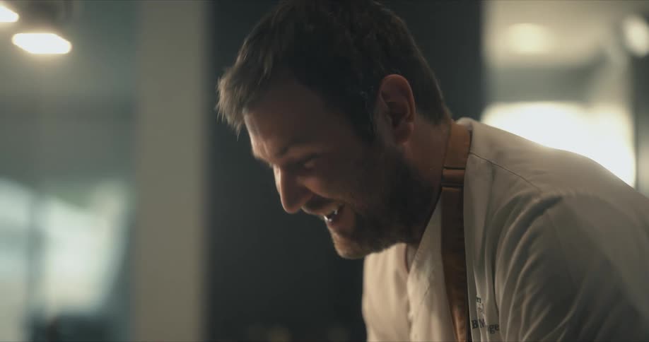 A chef is working in the kitchen