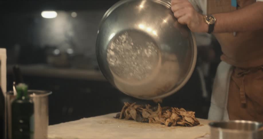 Two chefs cooking in a kitchen