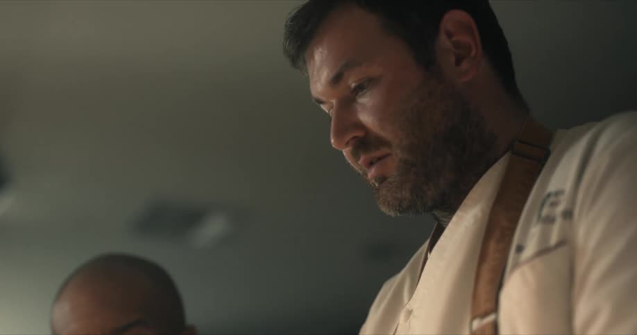 Two men look down as they look back and forth