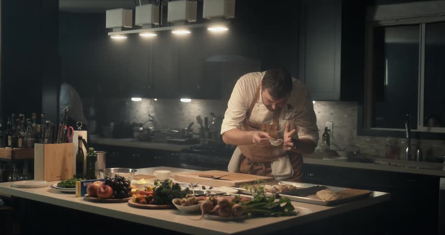 Two cooks are working in the kitchen