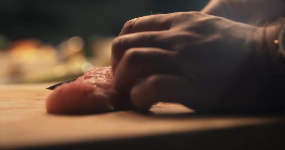 A person is cutting fish