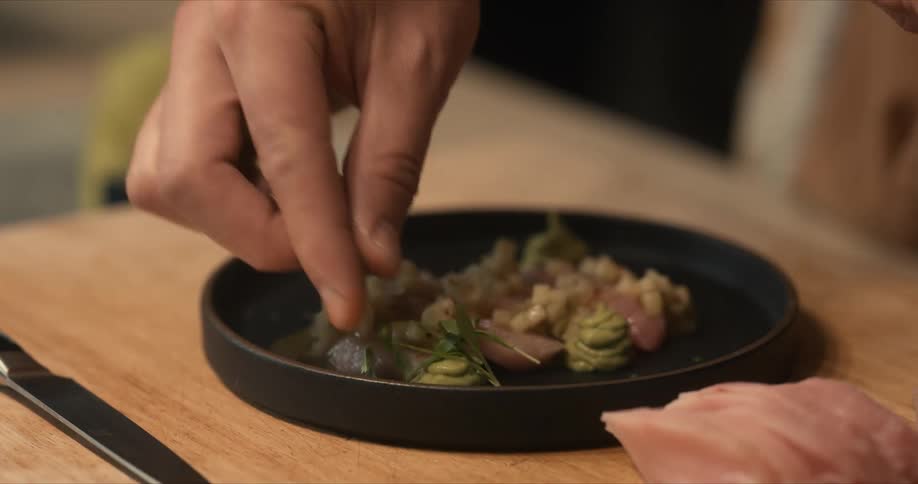 Person preparing dish
