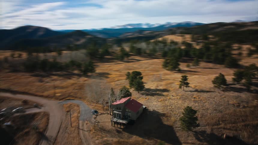 The homes are spread out on the hills