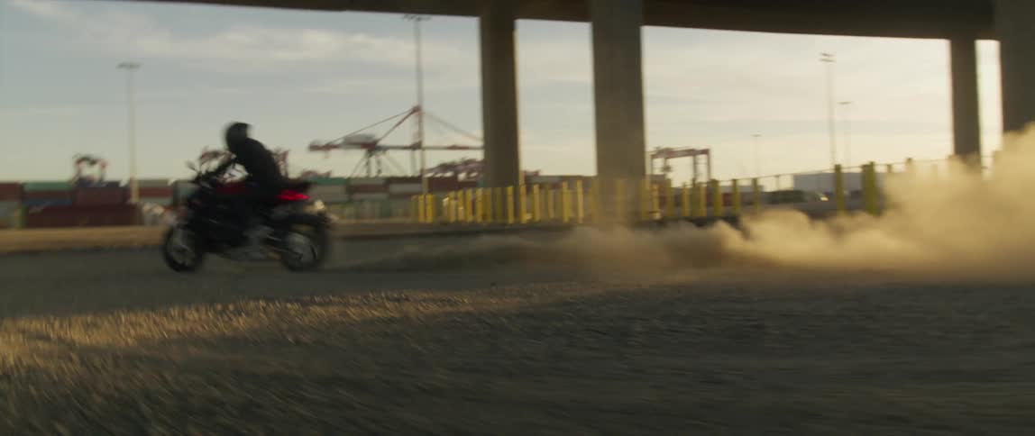 A person races their motorcycle