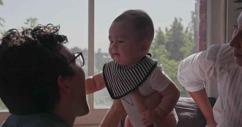 A man holds a baby