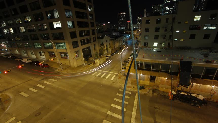 Time lapse of a city intersection at night