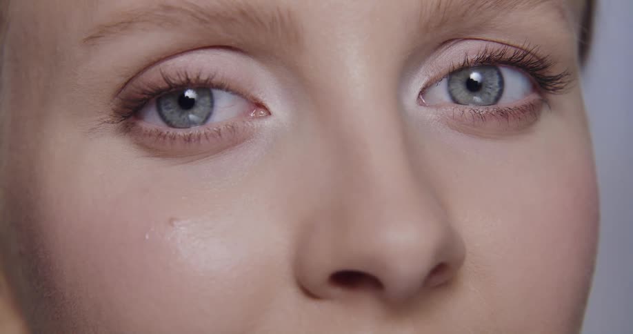 A model turns her head to the side while posing