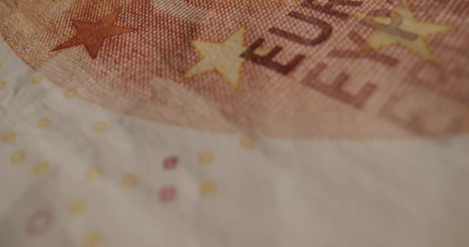 Banknotes being piled atop one another