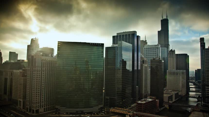 Clouds flowing in the sky over tall city buildings