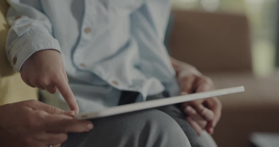 A child is using the tablet