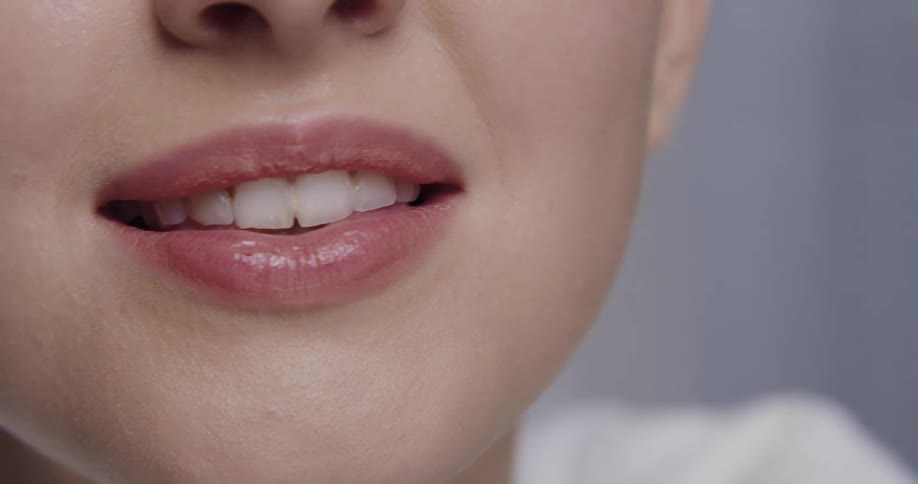Close up of female models face smiling and looking at camera