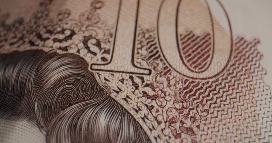 The artwork and numbering on a banknote