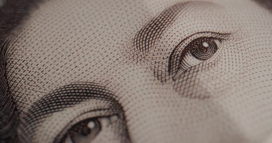 Close up of a bill with the queen on it