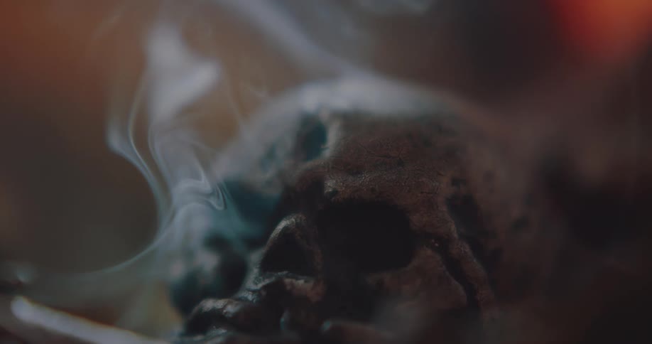 Smoking skull on table