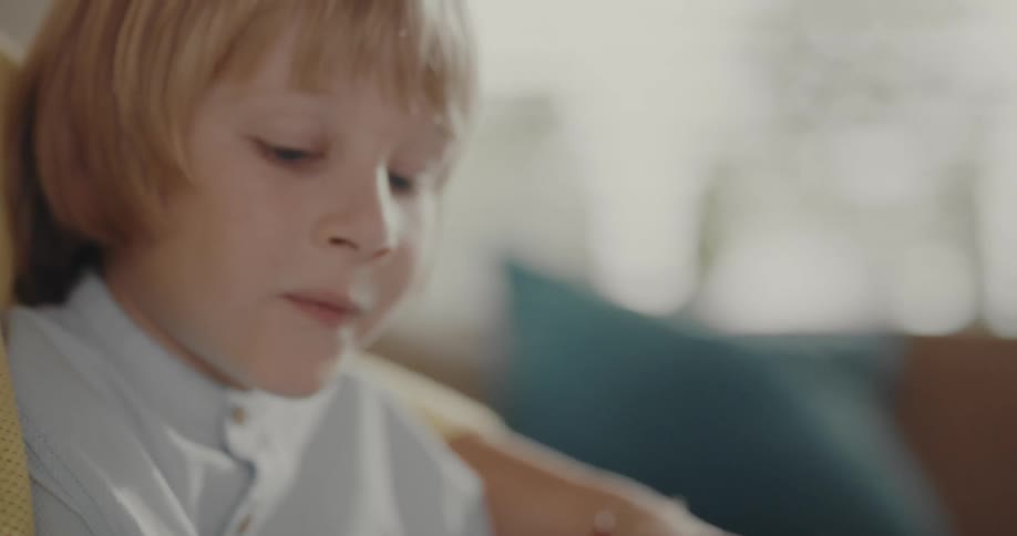 A child is reading from a book