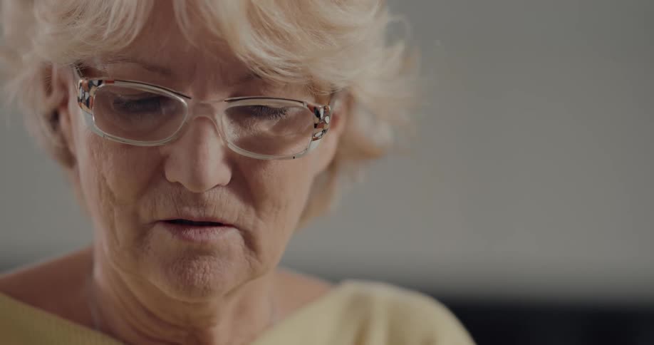 An elderly woman in a room