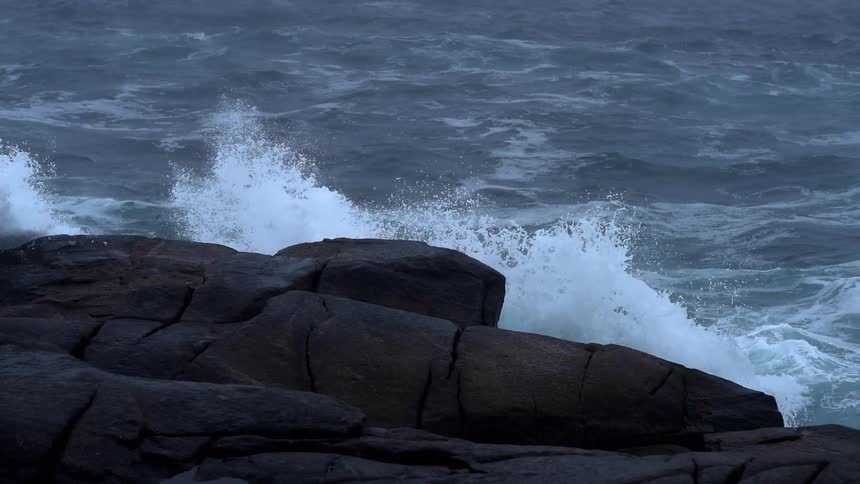Ocean waves splash up on the rocks