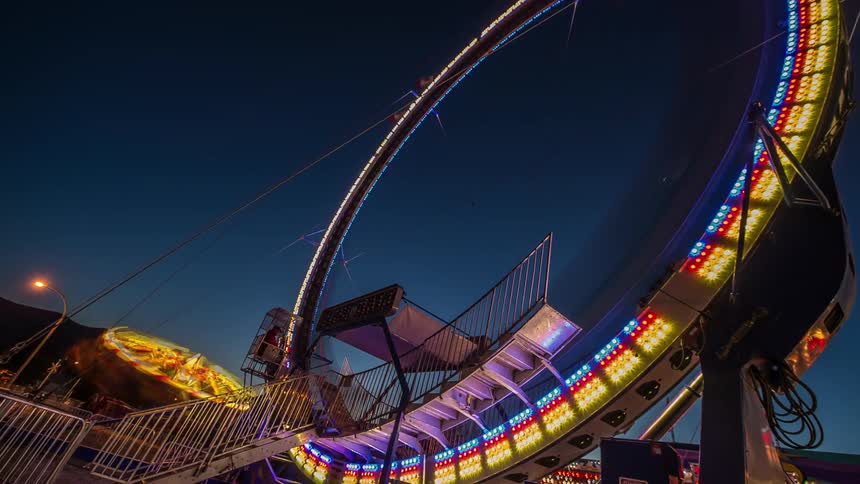 Time lapse of a carnival brightly lit at night