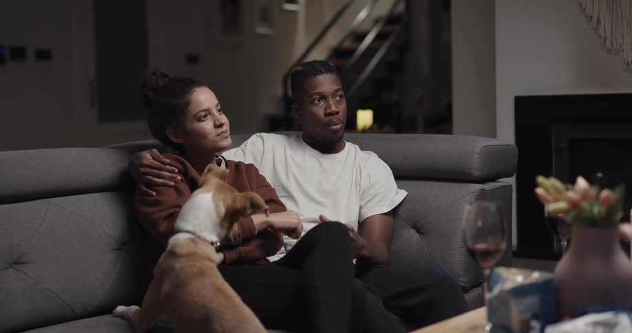 Young couple is hanging out with there dog