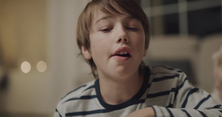 A child is sitting and talking