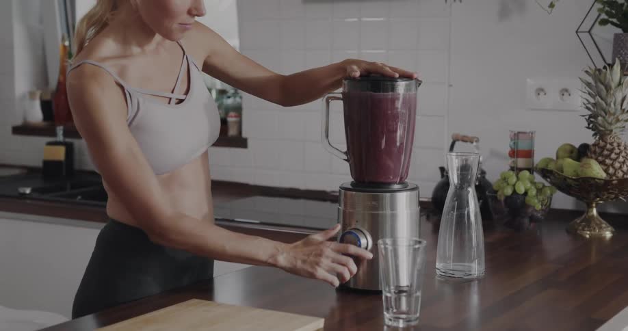 Young woman is making a smoothie