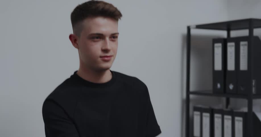 Young man is scanning a phone