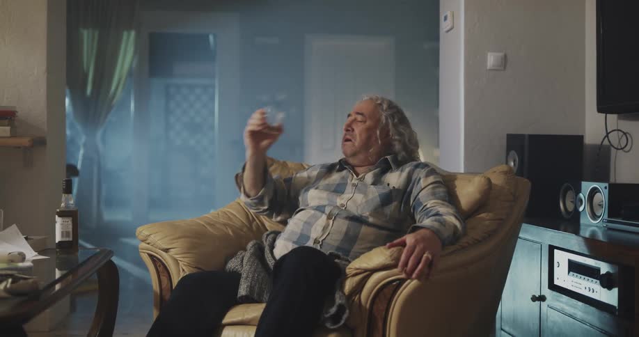 Old man is drinking alcohol