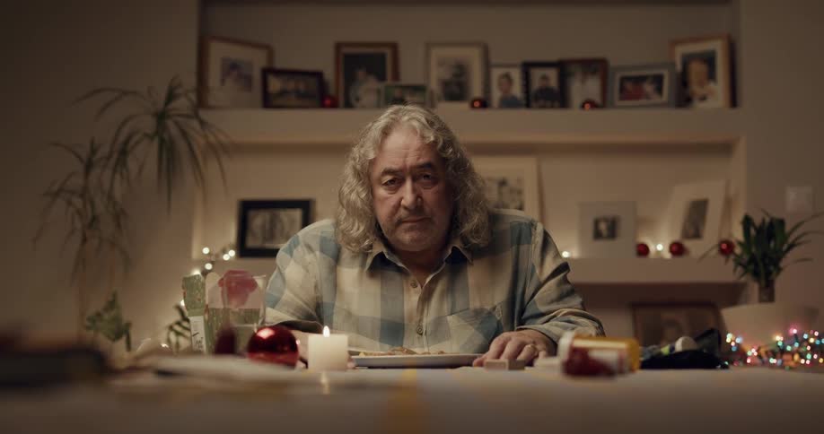 A man is eating dinner at a table by himself