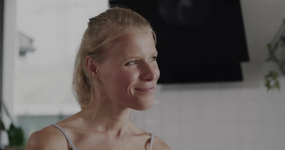 Young woman is drinking a smoothie