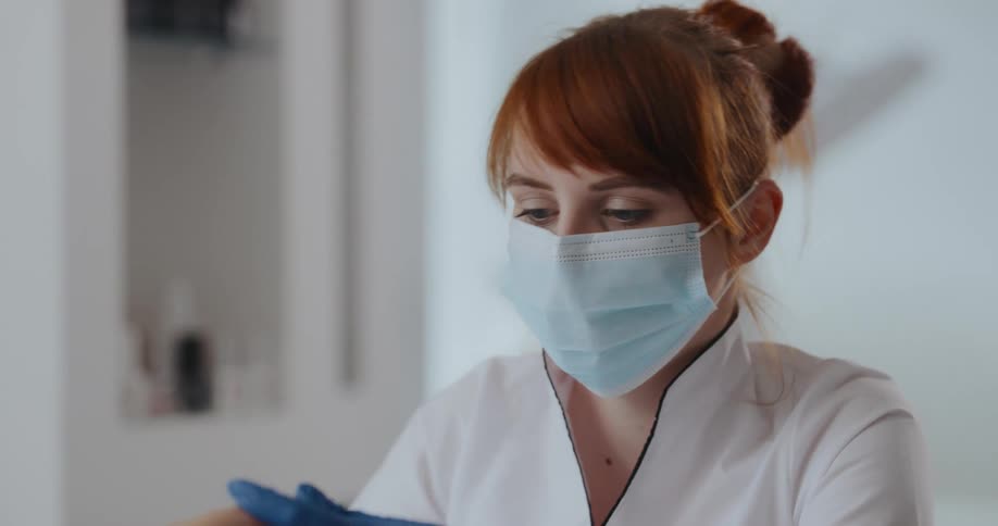 A doctor checking a patients hands