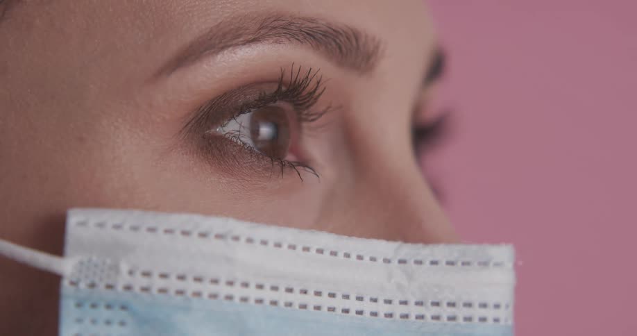 Close up of a womans face with a mask on