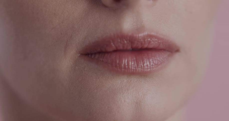 A woman is wearing lipstick