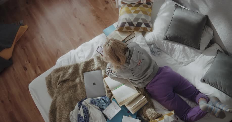 A woman laying on a bed relaxing